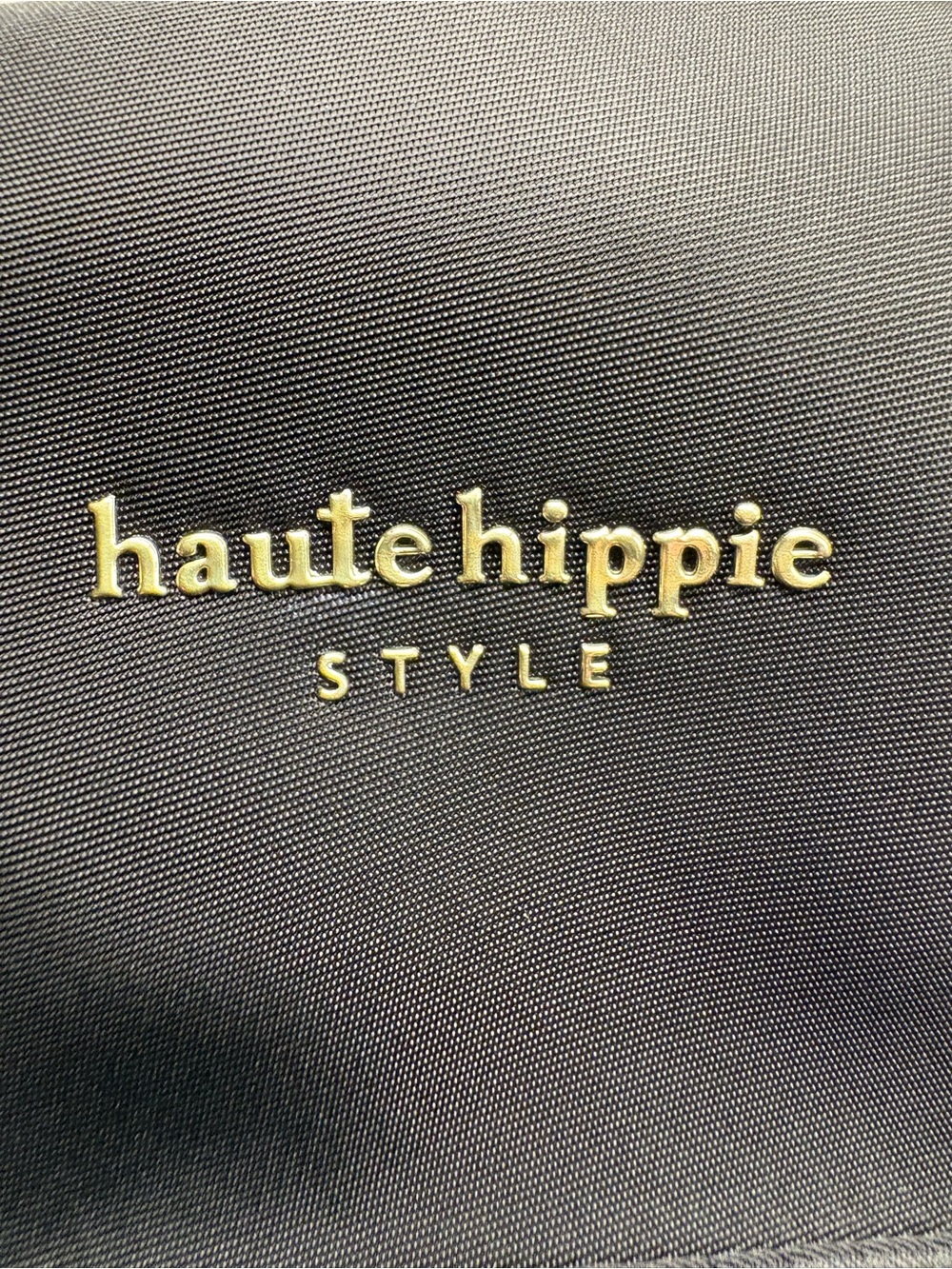 Haute Hippie back pack & green checked bathroom bag.